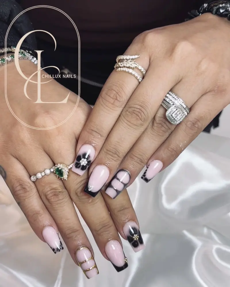 Pink nails with black flowers and gold chrome art at Chillux Nails, Orpington